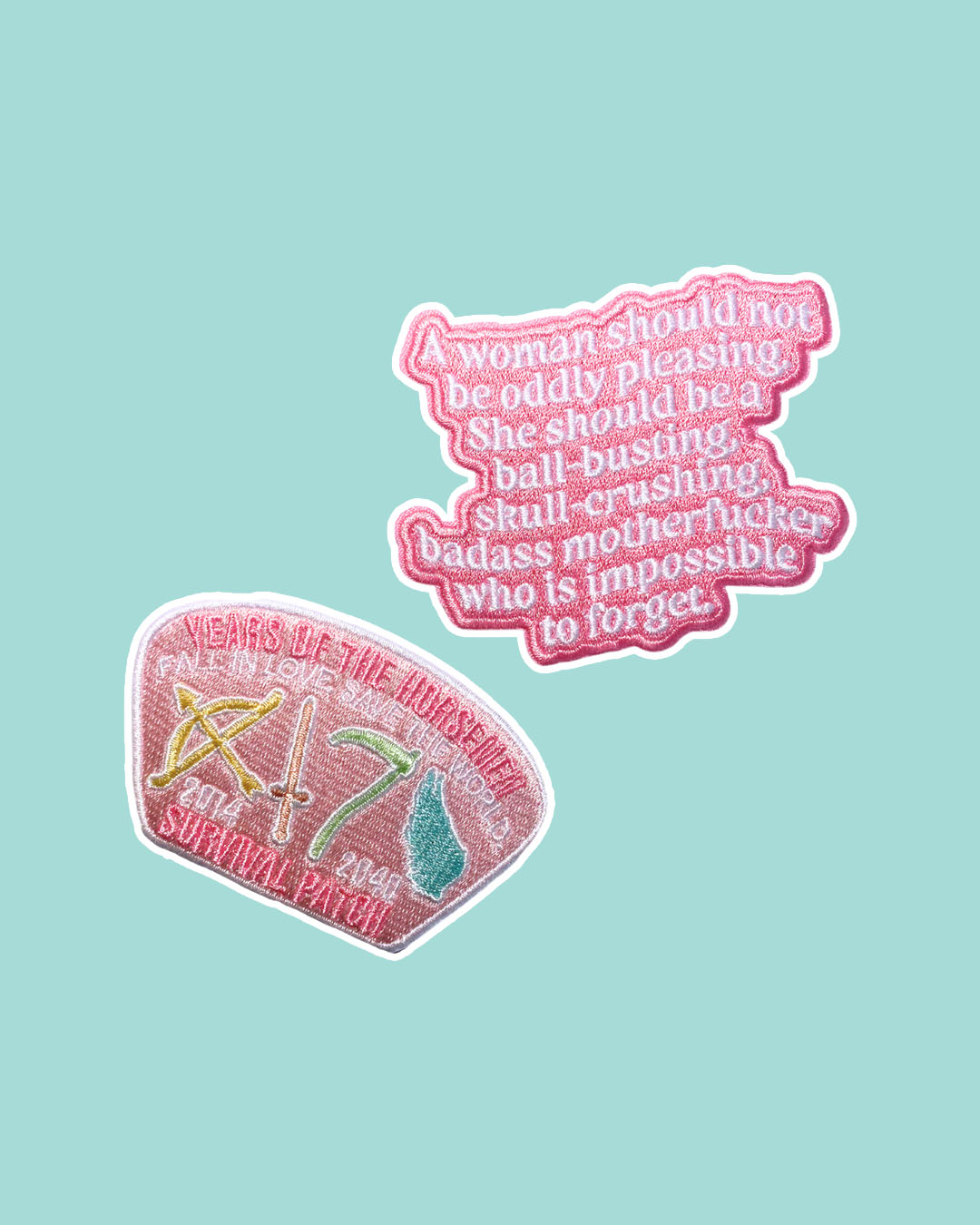 The Four Horsemen patch set for Laura Thalassa fans featuring the quote 'A woman should not be oddly pleasing. She should be a ball-busting, skull-crushing, badass motherfucker who is impossible to forget' on a pink background and 'Survival Patch' for the 'Years of the Horsemen' featuring a bow, a sword, a scythe, and a wing.