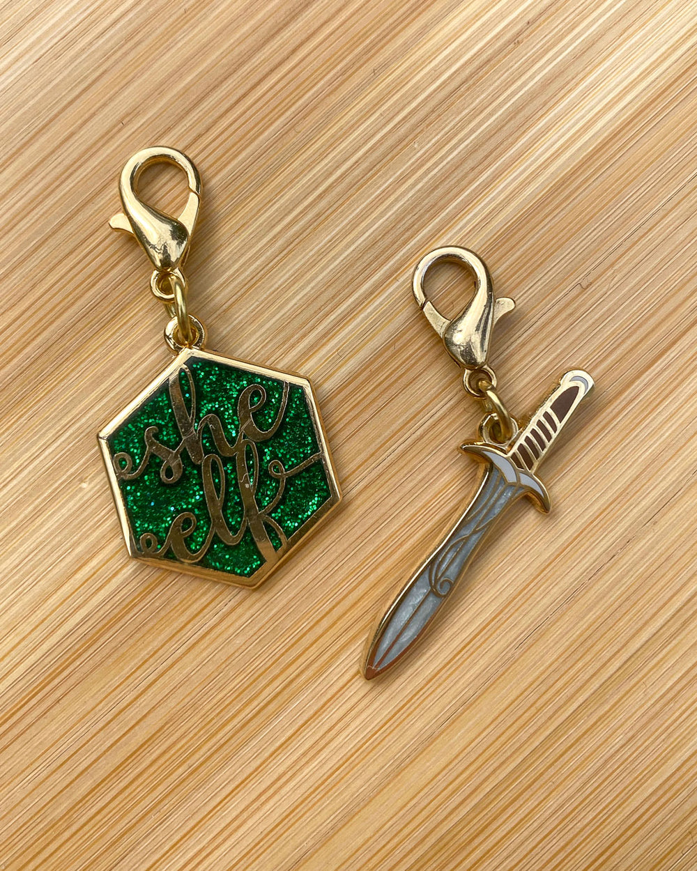 LOTR charm set featuring a green glitter 'she elf' charm and a sword design for Frodo's sword, Sting.