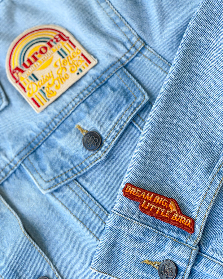 Daisy Jones patch set featuring a design for the Aurora World Tour logo and a patch with the quote &