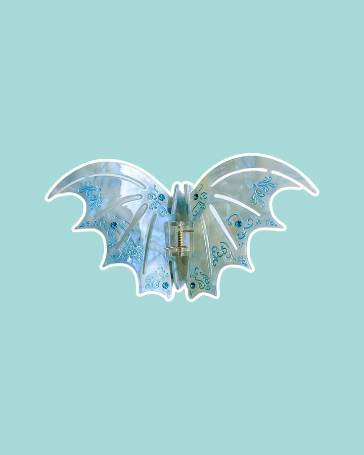 ACOTAR-inspired bat boy hair claw clips in pastel blue with etching details and blue gem embellishments for Sarah J. Maas fans.