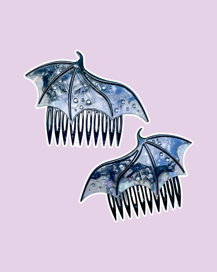 Dragon wing hair combs for fantasy fans in black featuring engraved embellishments and a pearlescent black color.