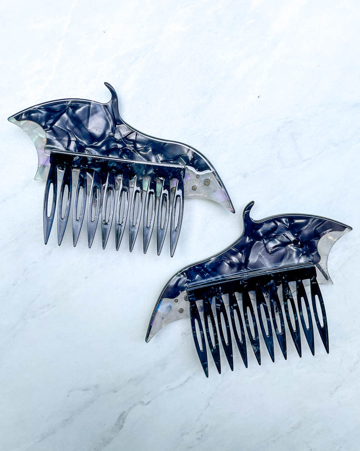 Back of the dragon wing hair accessories featuring a set of black hair combs and a pearlescent color.
