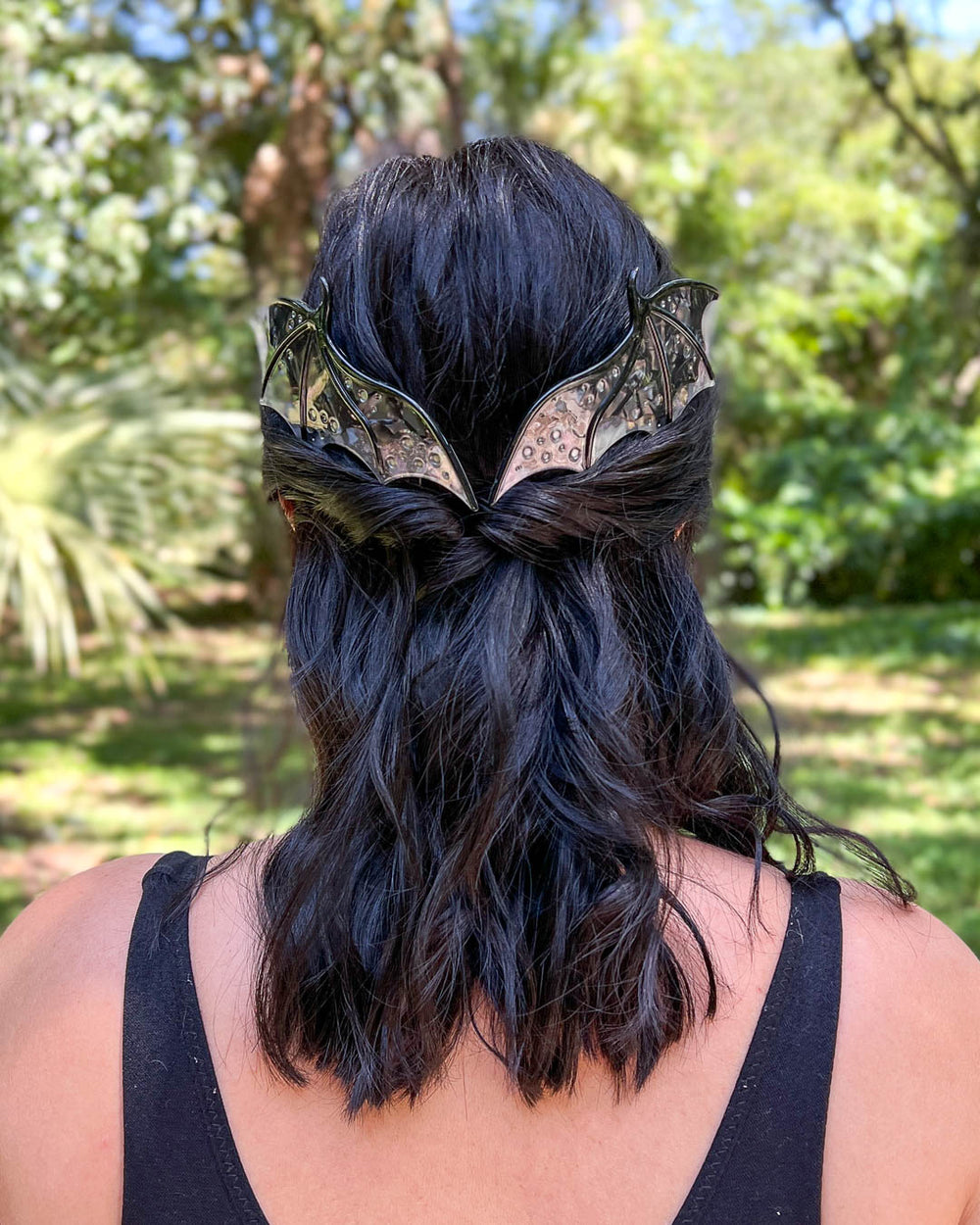 Dragon hair combs with engraved embellishments and a black-toned pearlescent acetate material. 