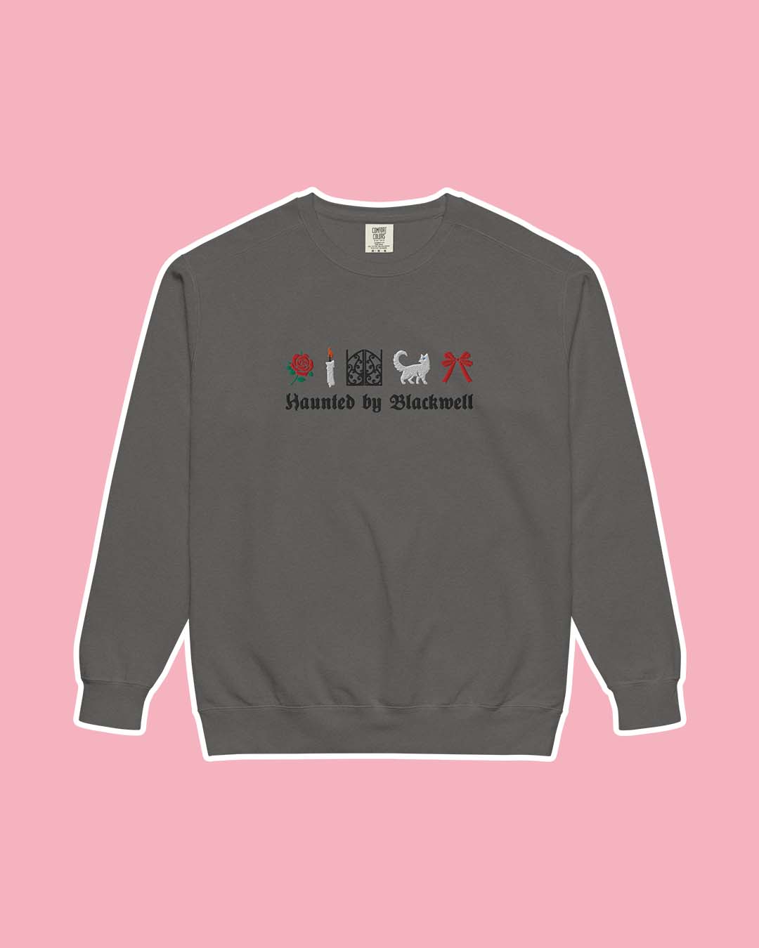Phantasma sweatshirt for Kaylie Smith fans featuring a gray sweatshirt with embroidered illustrations including a rose, a candle, gates, a white cat, and a red bow with 'Haunted by Blackwell' written beneath it.