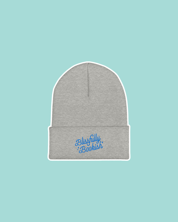 Gray beanie embroidered with the Blissfully Bookish logo in blue.