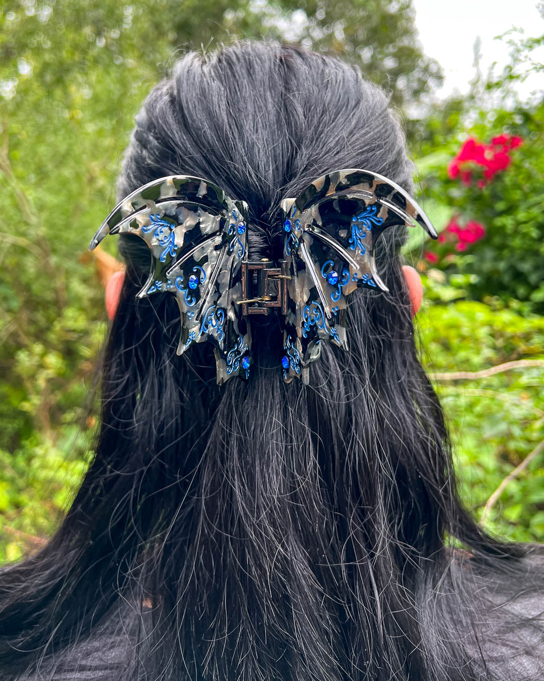 Blue A Court of Thorns and Roses hair accessory with blue gem embellishments and etching details.