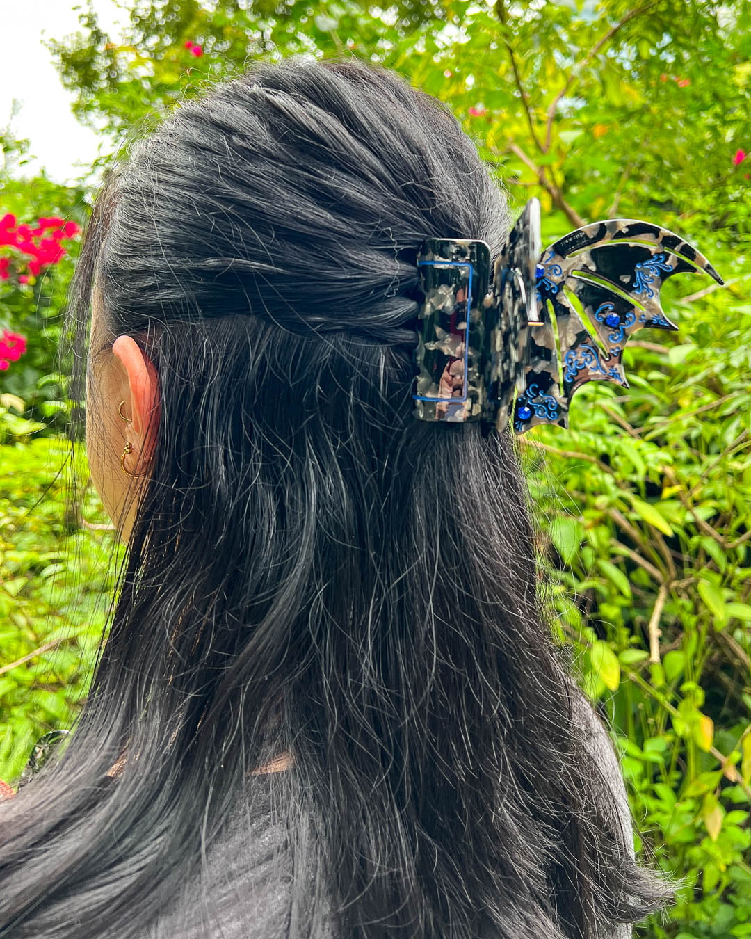Hair clips for ACOTAR fans featuring blue and black clips in shape of bat wings with gem embellishments and etching details.