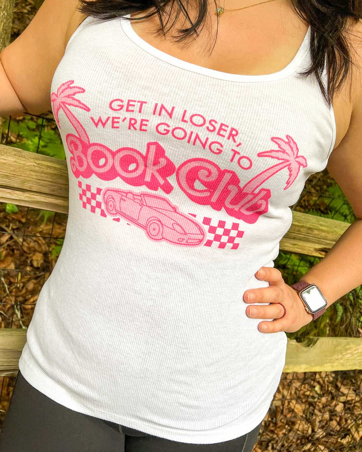 Ribbed tank top for book lovers with palm trees and a car illustrated around the quote &