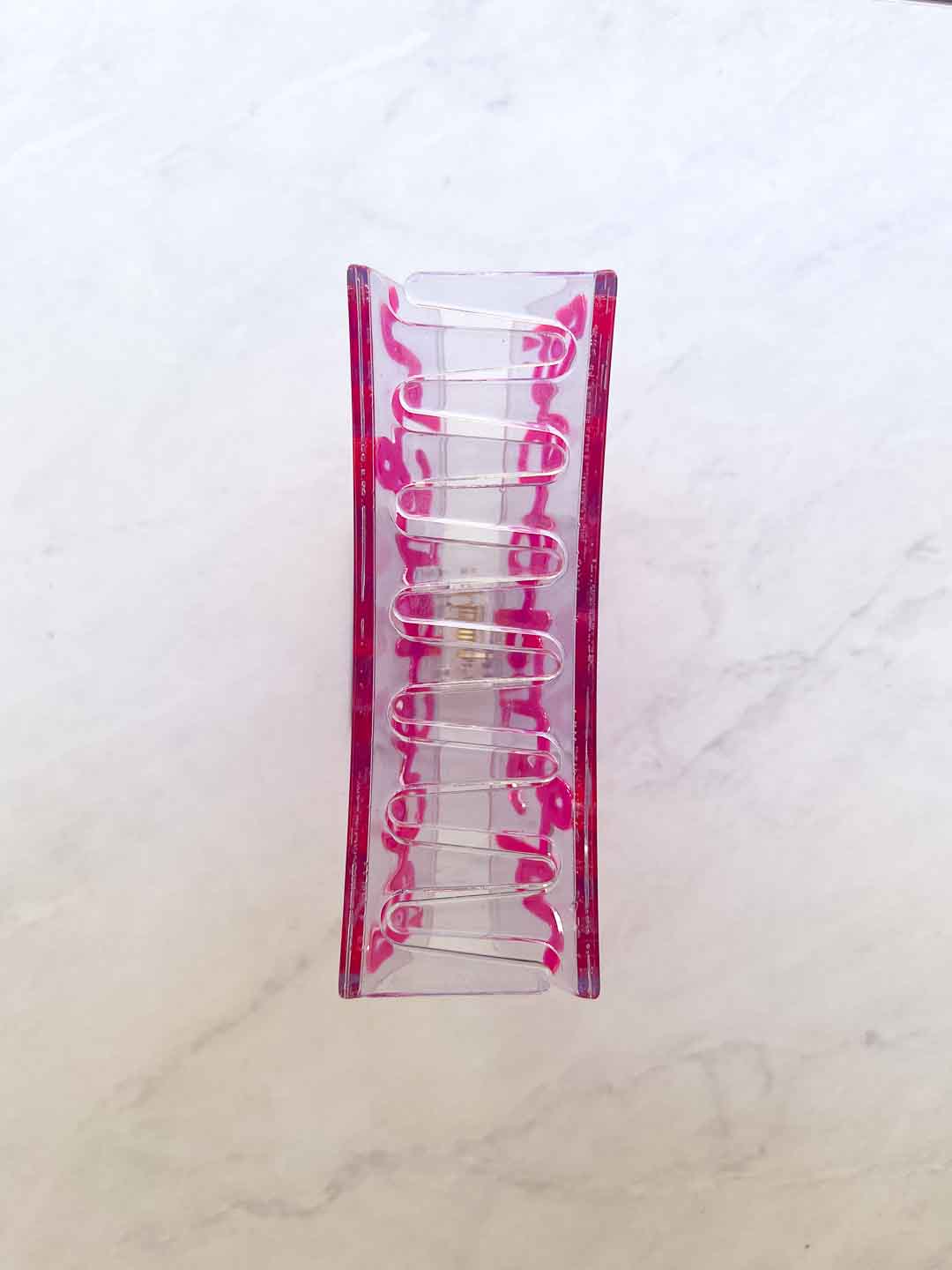 Bookish claw clip featuring transparent acetate material with &