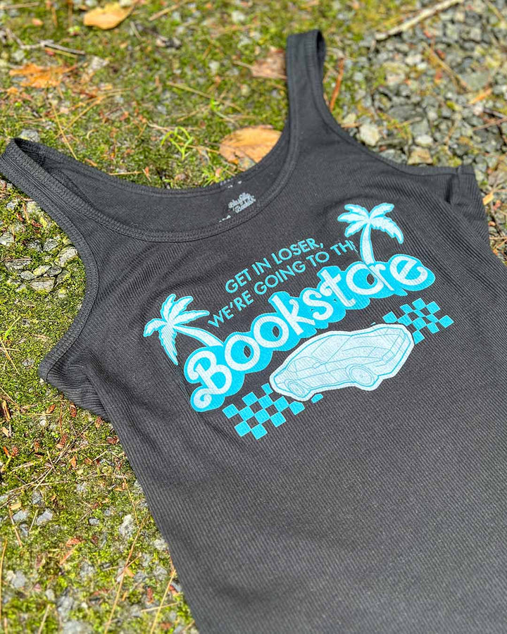 Flat lay of the bookish y2k tank top highlighting the quote &