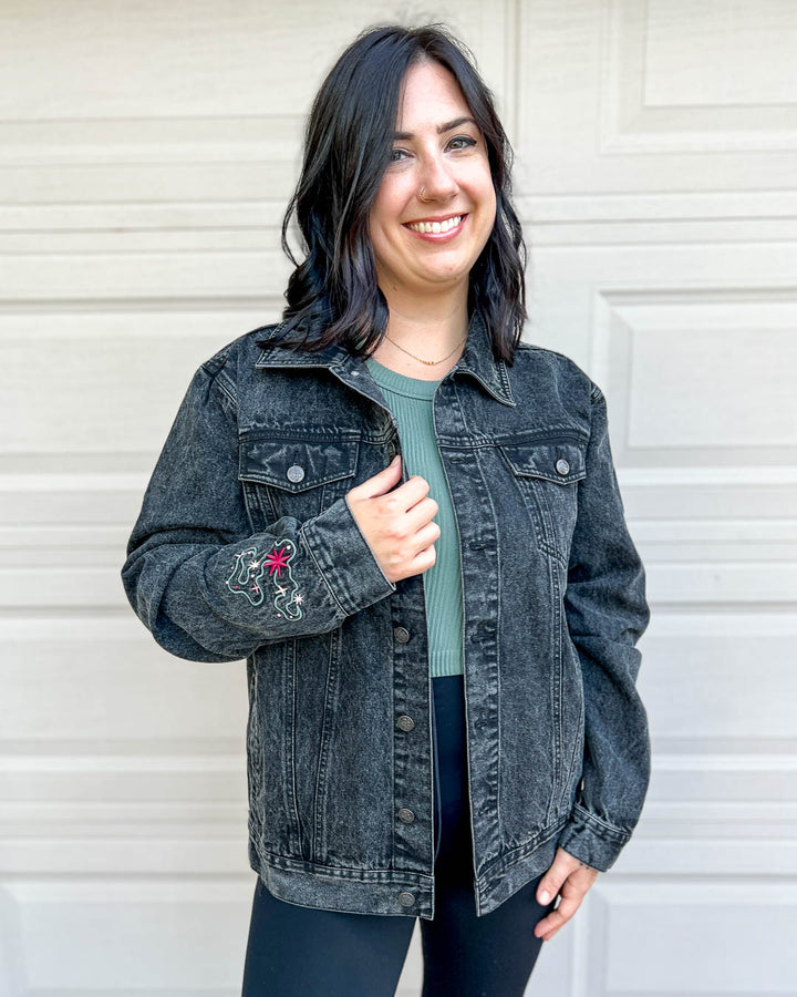 Front of the embroidered denim jacket for fantasy fans and dragon riders featuring the oversized fit and the sleeve detail.