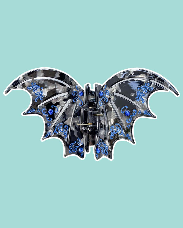SJM hair clip in black and blue with gem embellishments inspired by the bat boys from A Court of Thorns and Roses by Sarah J. Maas. 