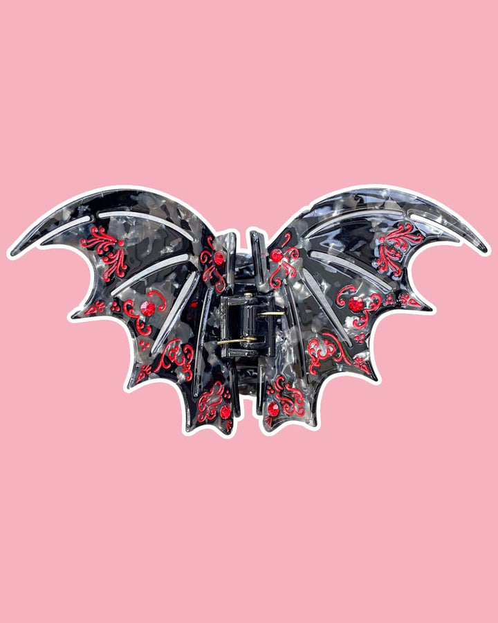 SJM hair clip in black and red with gem embellishments inspired by the bat boys from A Court of Thorns and Roses by Sarah J. Maas. 