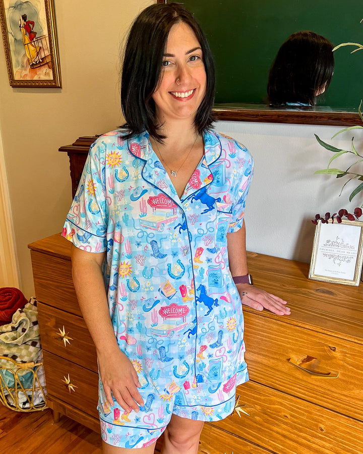 Romance pjs set for cowboy fans featuring classic symbols of the genre including lassos, trucks, horseshoes, cowboy boots, and more.