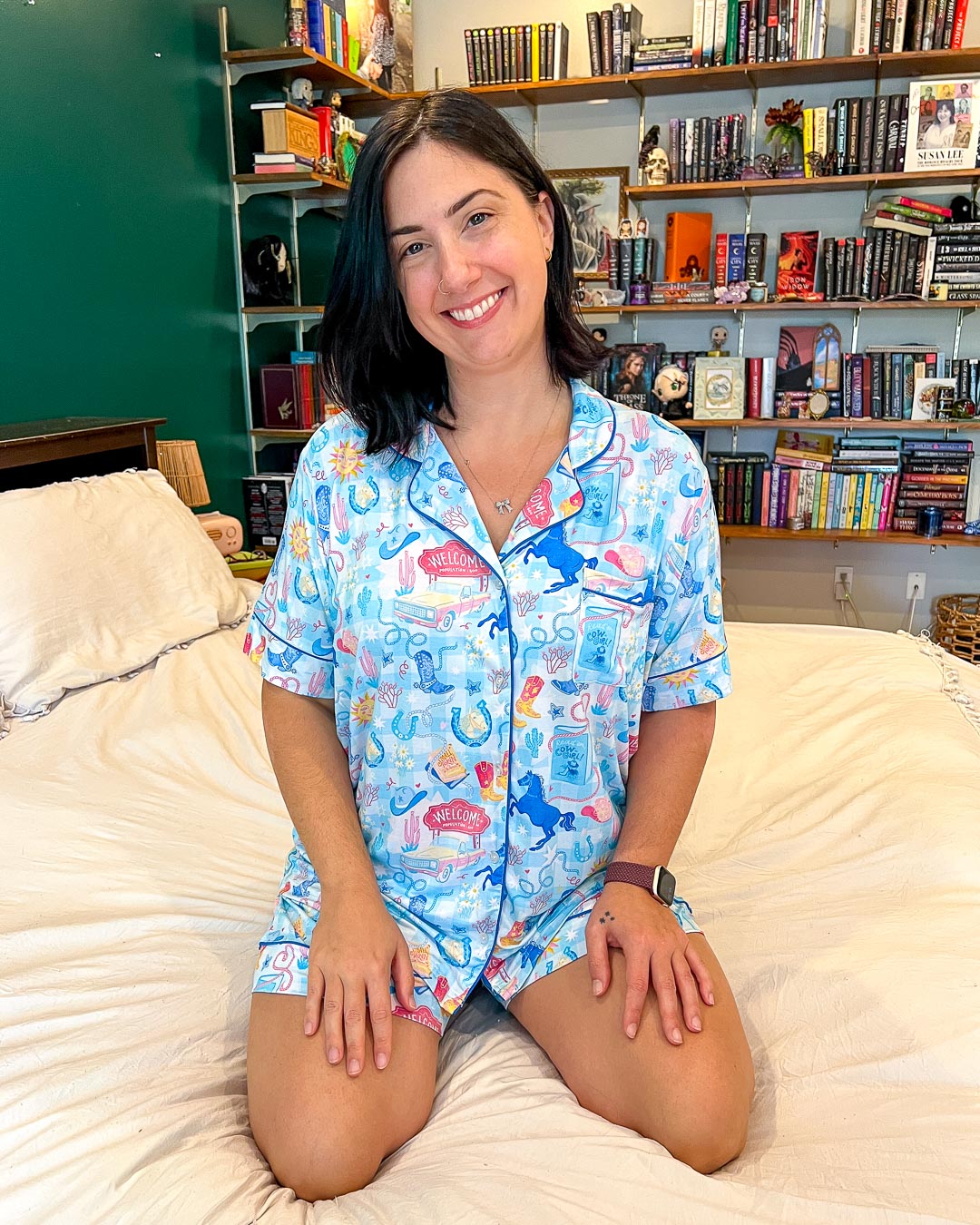 Bookish pjs set for cowboy romance readers with a cute illustrated pattern of lassos, horses, a welcome sign, horseshoes, and cowboy hats.
