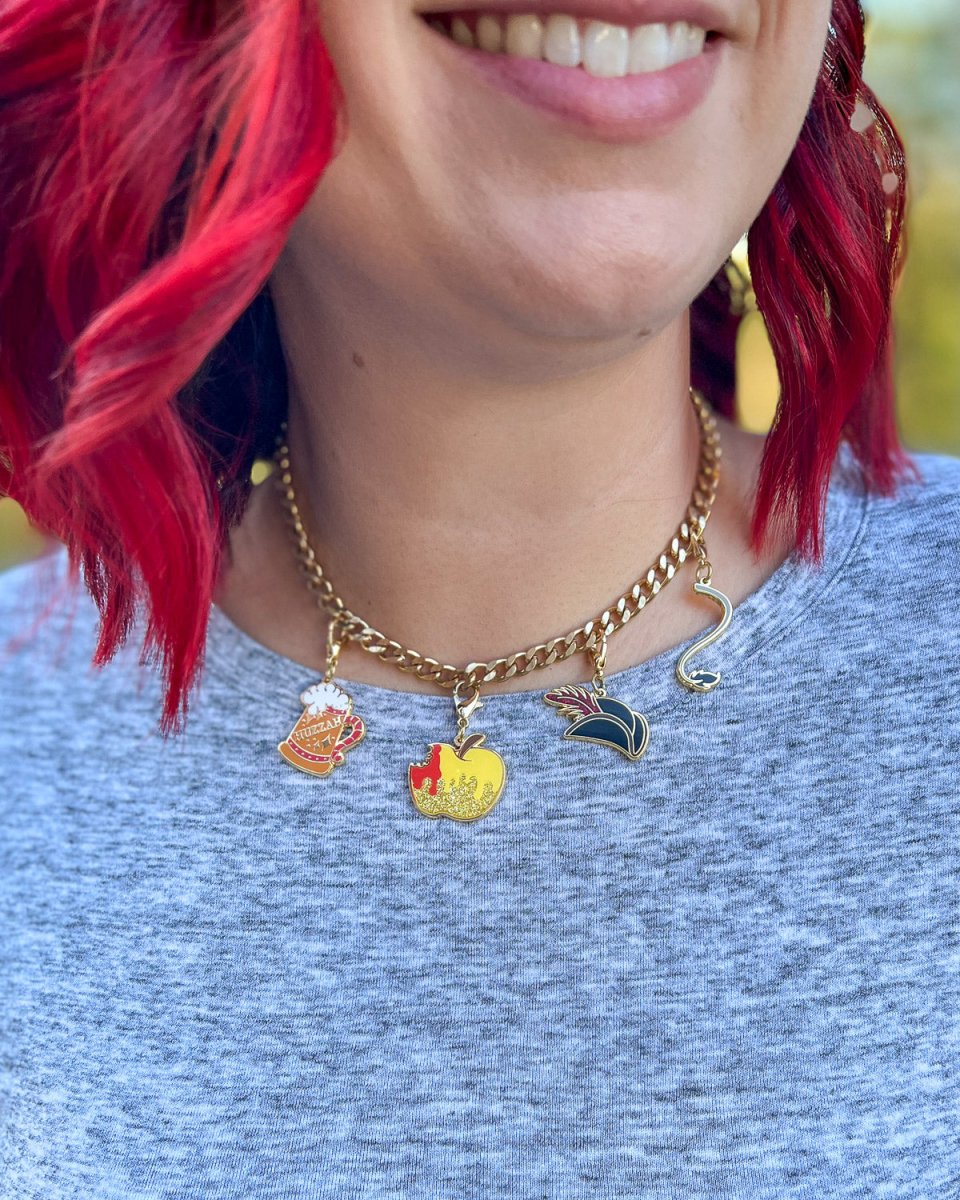 Bookish charm set for Cruel Prince fans featuring a golden apple with glitter elements and blood and Cardan&