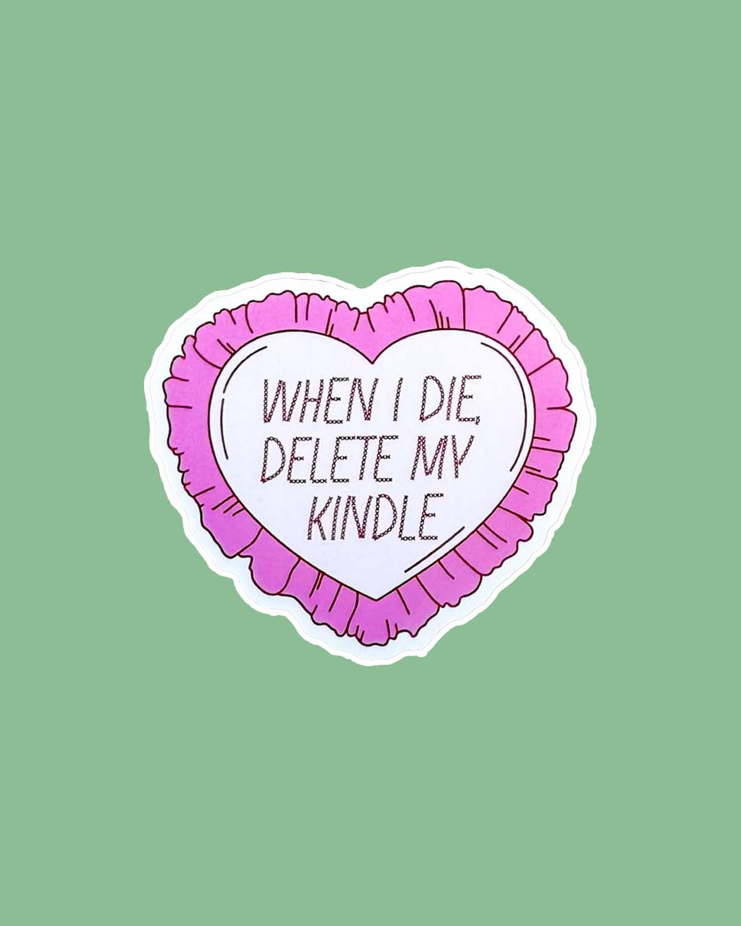Bookish sticker featuring the phrase 'When I die, delete my kindle' in heart lined with pink fringe.
