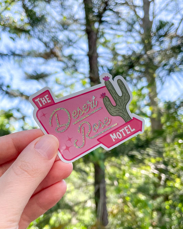 The Desert Rose Motel sticker for Emily Henry fans featuring a sign for the Desert Rose Motel and an illustrated cactus from People We Meet on Vacation.