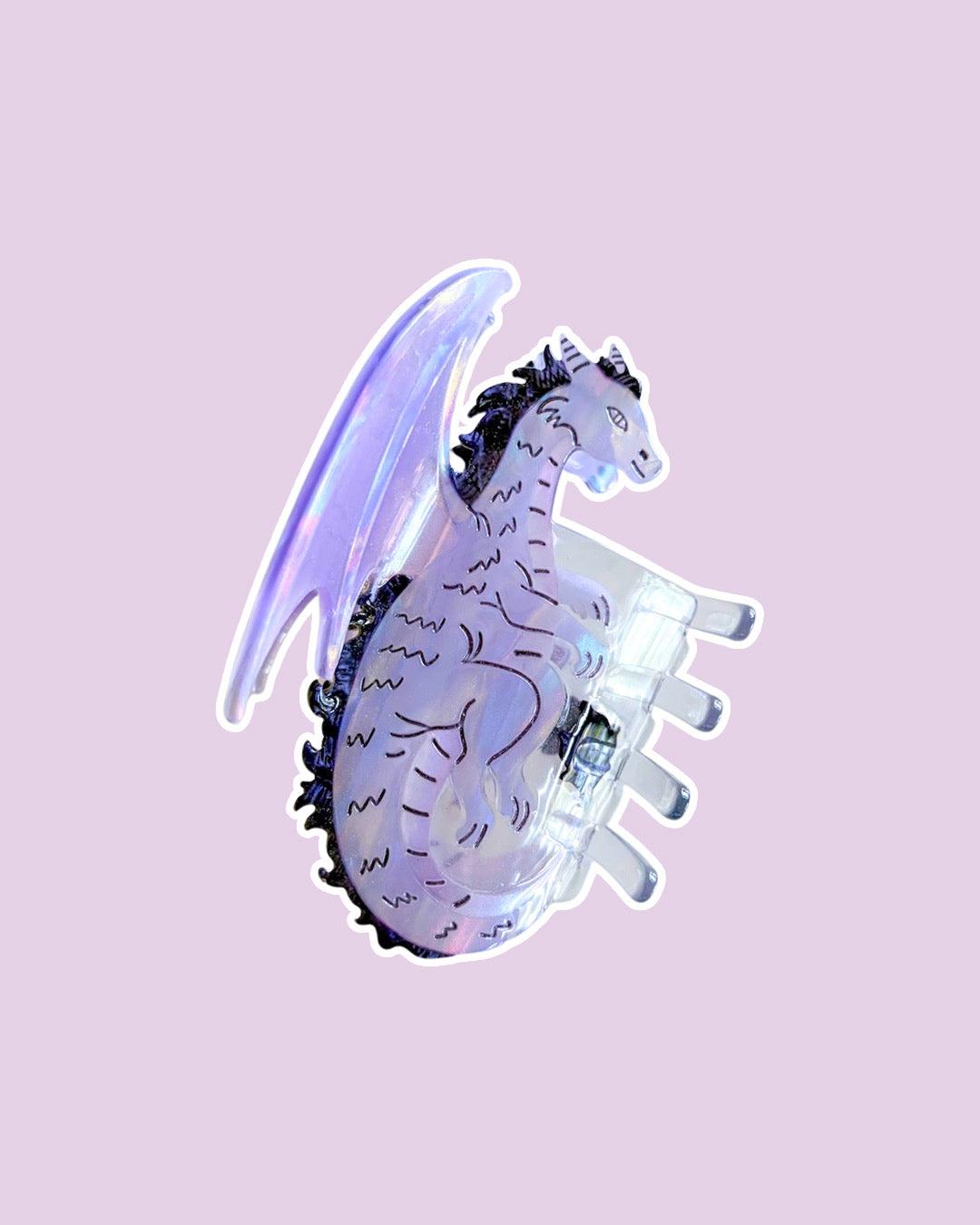 Purple dragon hair claw clip for fantasy readers with an iridescent shine on a purple background.