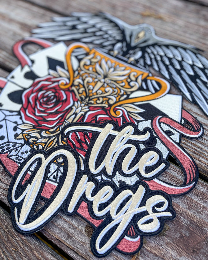 Close up of the Six of Crows iron-on patch for book lovers featuring the detail of the phrase &