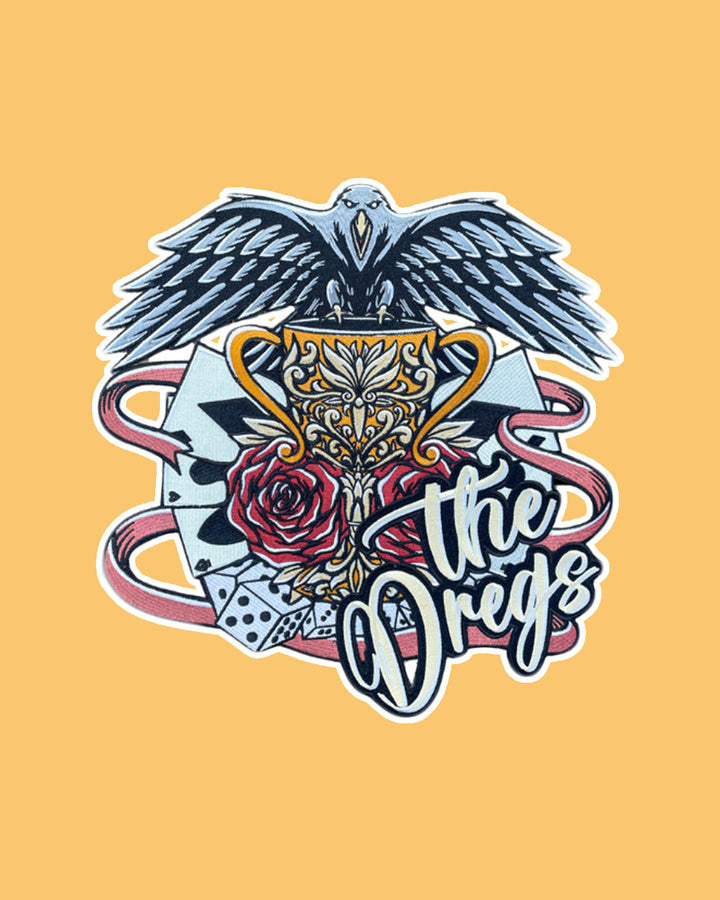 Iron on Six of Crows patch for Leigh Bardugo fans featuring a busy design with a crow perched atop a chalice, roses, playing cards, dice, and &