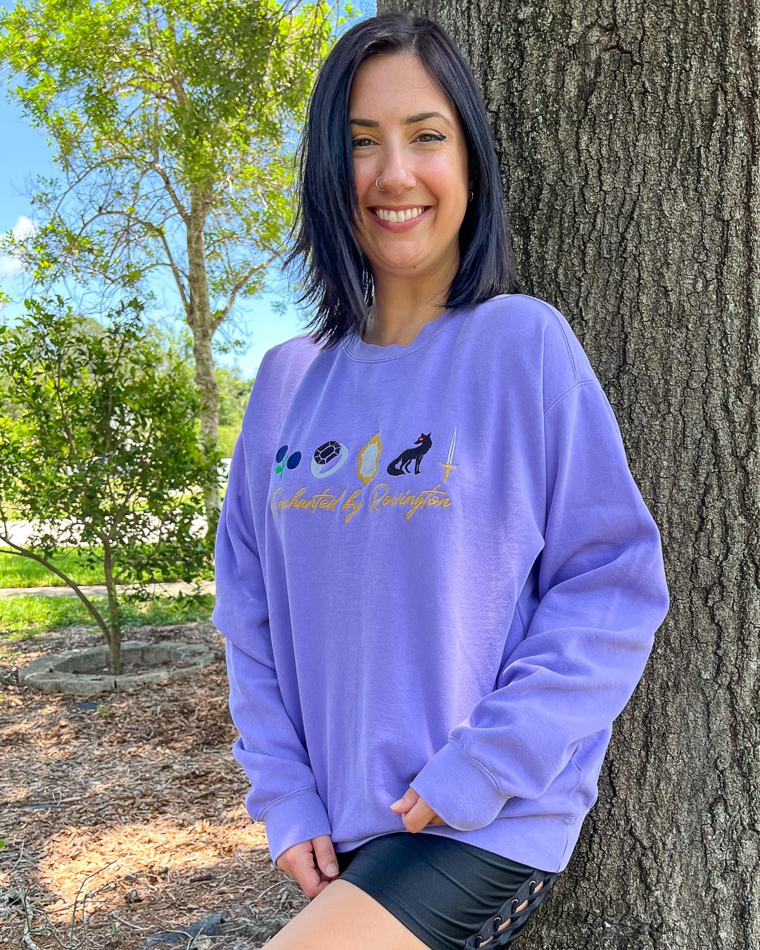 Kaylie Smith sweatshirt for Enchantra fans featuring a vibrant violet color with embroidered elements and the text &