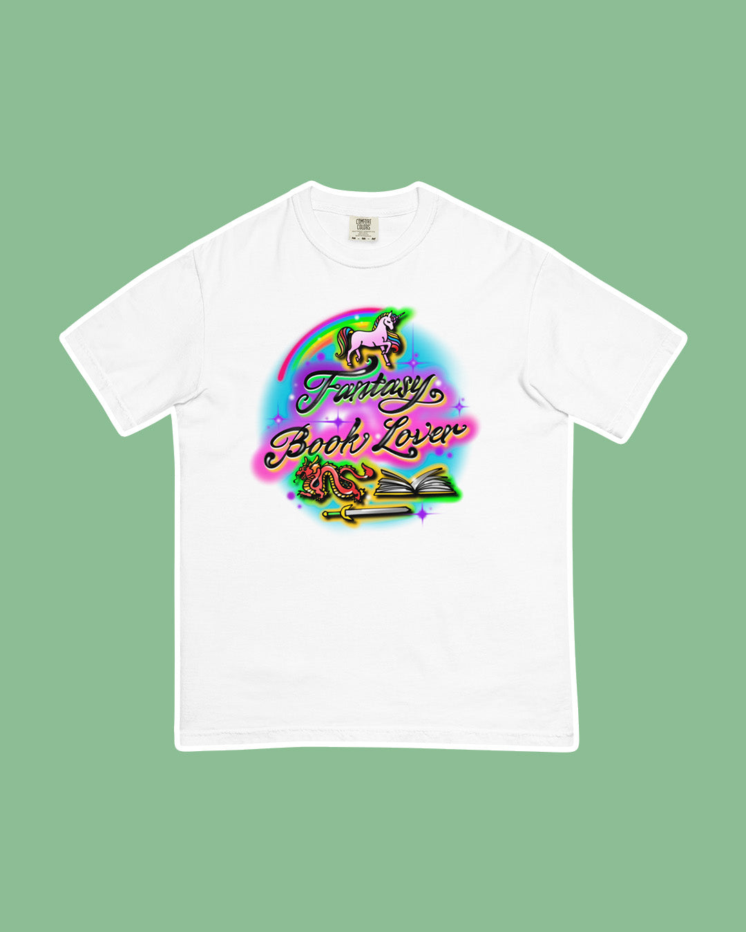 Fantasy shirt in an airbrushed design featuring 'Fantasy Book Lover' with a unicorn, a dragon, an open book, and a sword in vibrant colors.