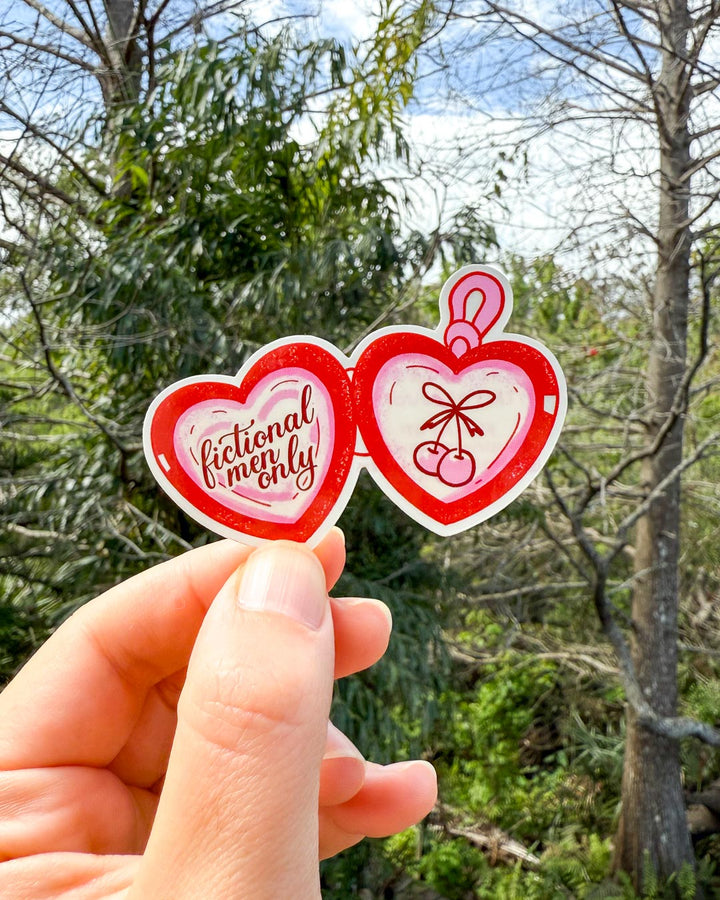 Heart-shaped sticker for readers featuring a red locket with &