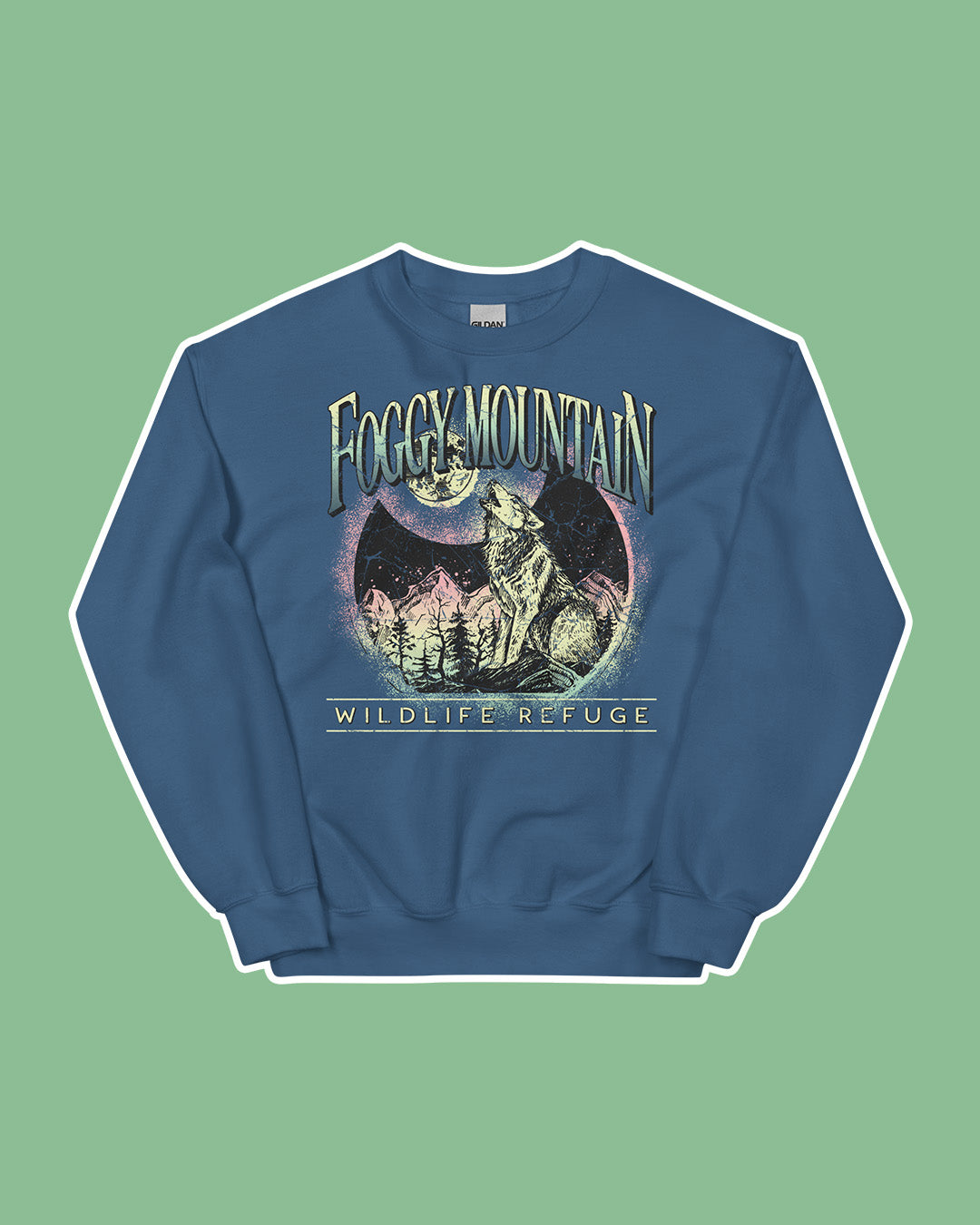 Wild is the Witch sweatshirt for Rachel Griffin fans featuring a design for the 'Foggy Mountain Wildlife Refuge' with a wolf howling at the moon, mountains, and pines.