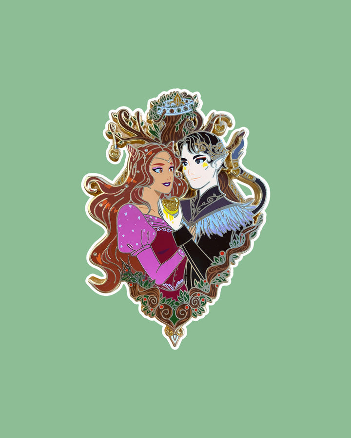 The Cruel Prince enamel pin featuring Jude and Cardan designed with crowns and faerie fruit.