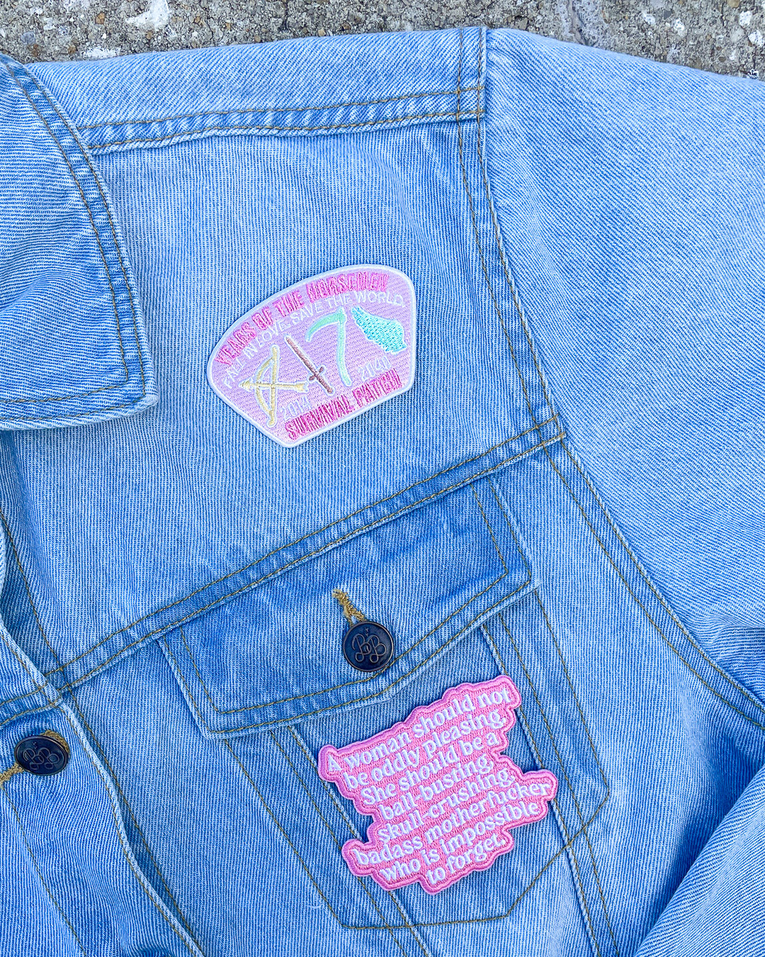 Laura Thalassa merchandise featuring two patches in pink, one designed as a survival patch for the years of the horseman and another with the quote &