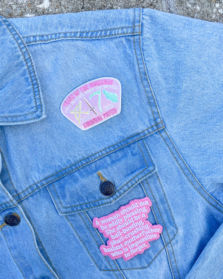 Laura Thalassa merchandise featuring two patches in pink, one designed as a survival patch for the years of the horseman and another with the quote &
