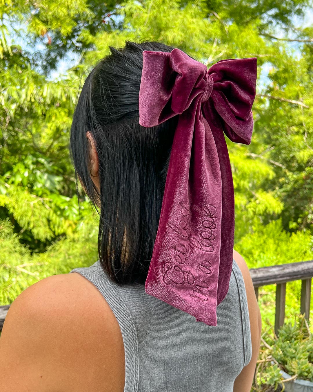 Bookish hair accessory with plum velvet and the phrase &