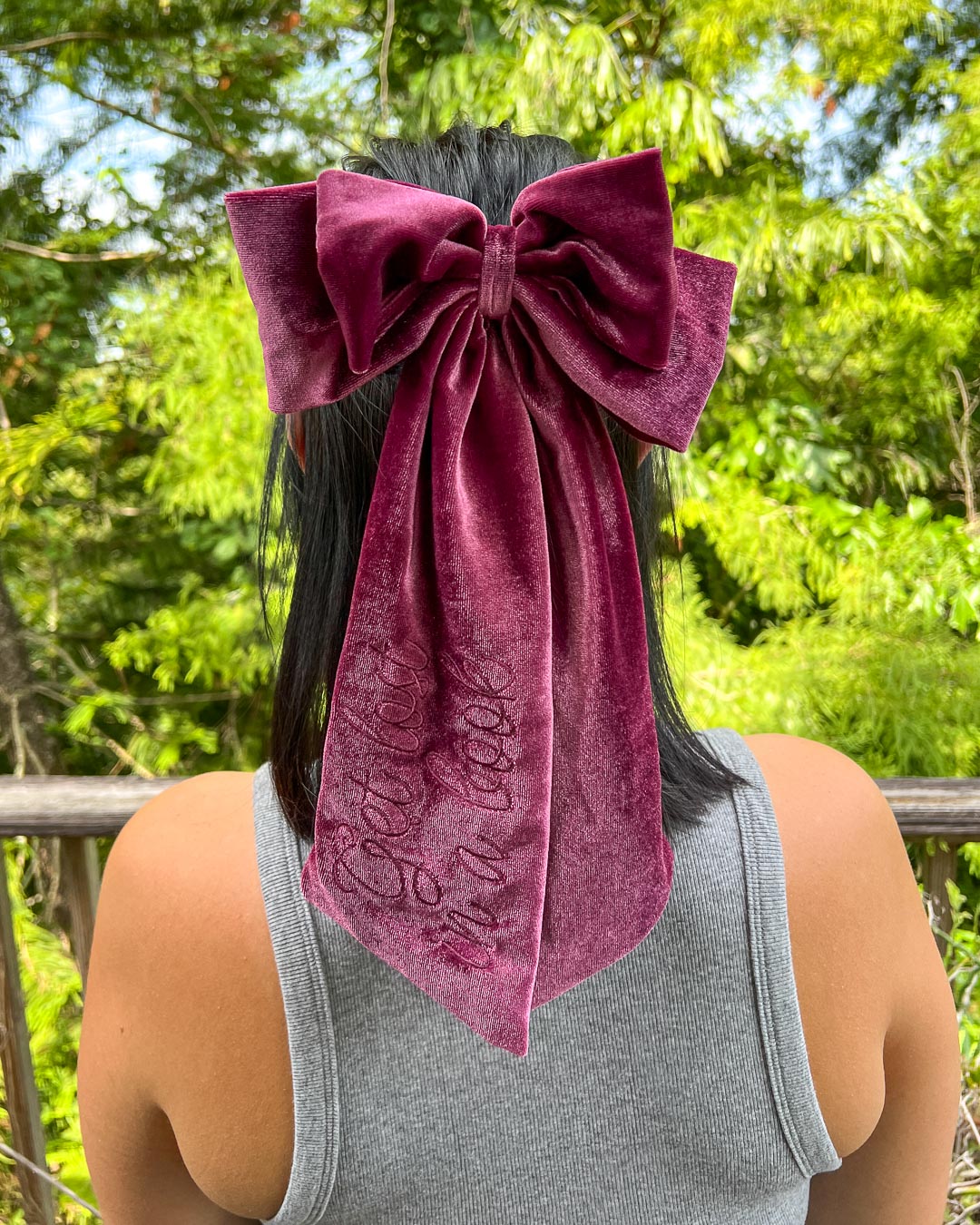 Bookish hair bow made with plum velvet and embroidered elements.