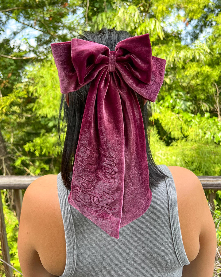 Bookish hair bow made with plum velvet and embroidered elements.