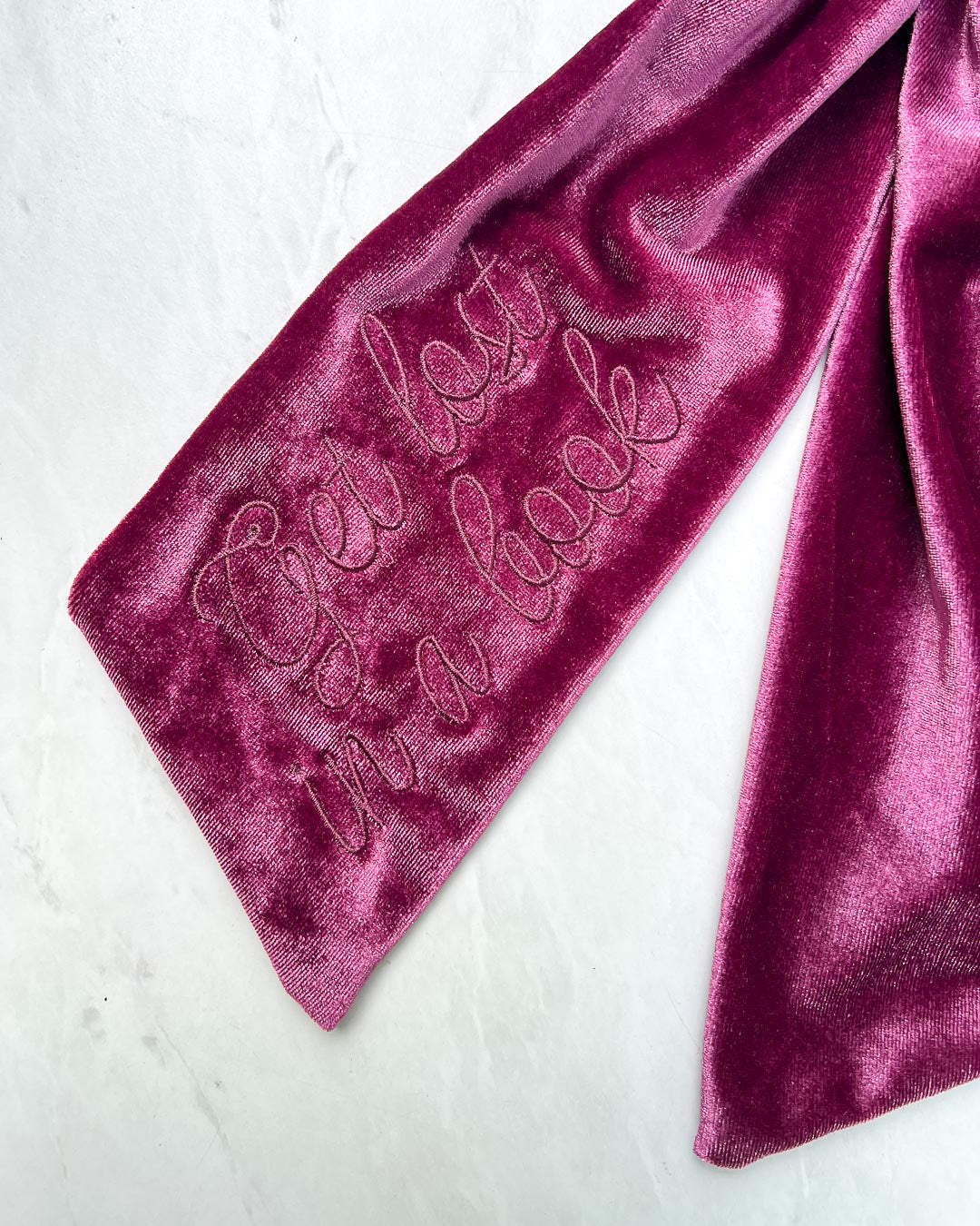 Close up of the embroidered &