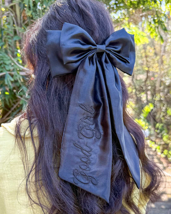 Embroidered hair bow designed in black satin with &