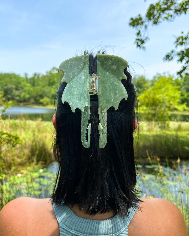 Dragon hair claw clip with green tones and gold etching details for fantasy lovers.