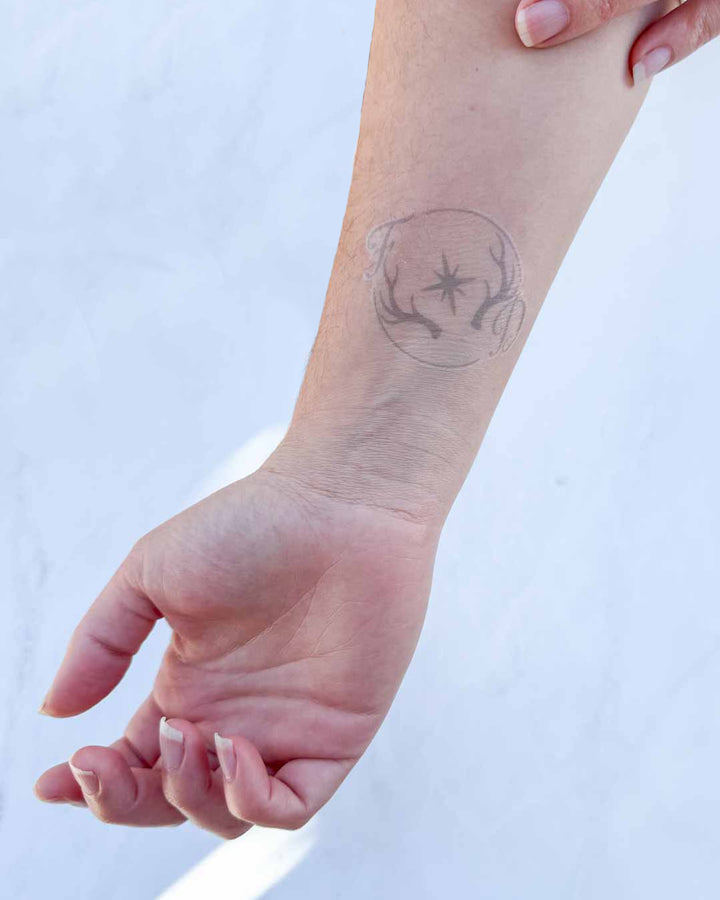 The Fever Dream temporary tattoo on the inside of a person&