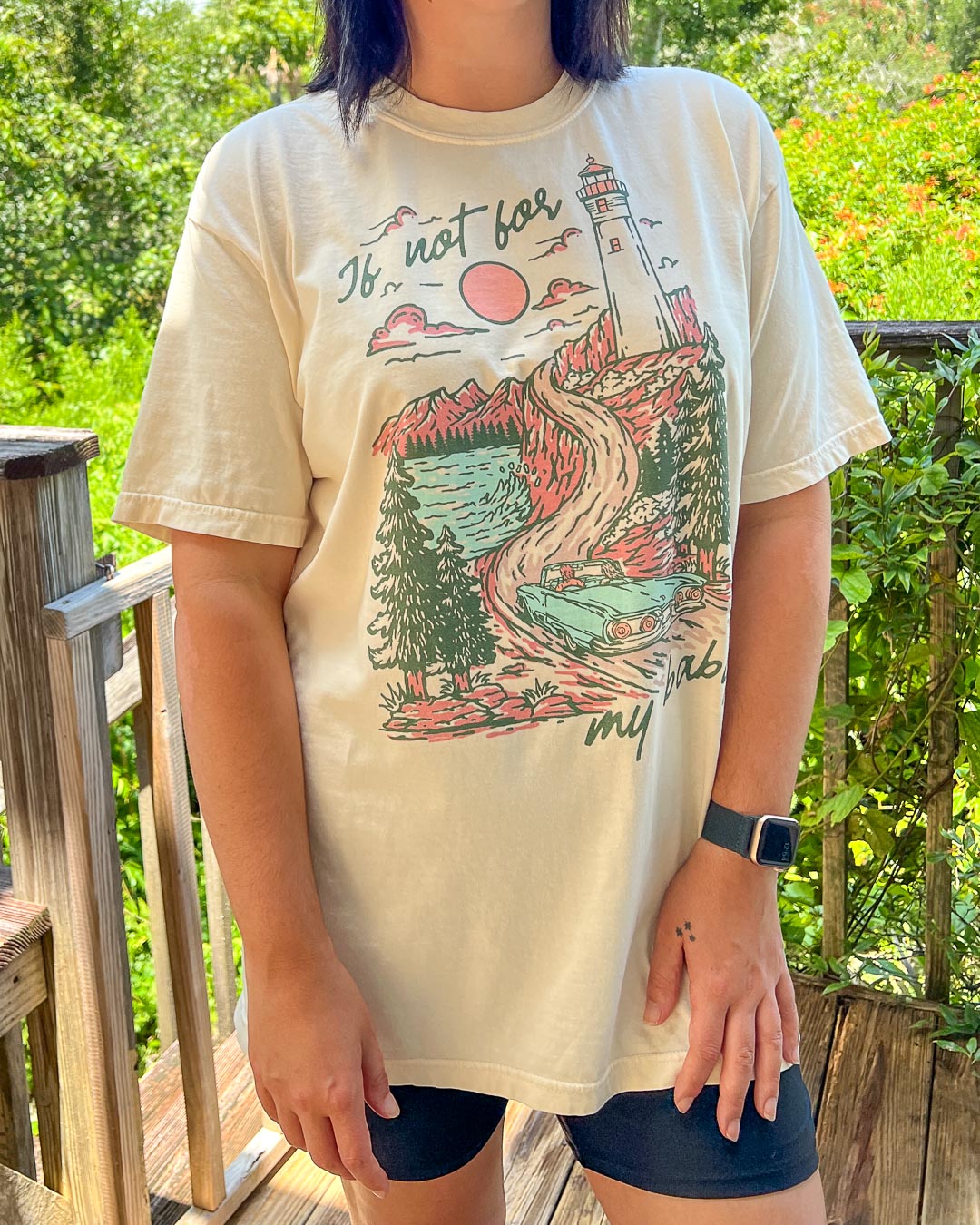 If Not For My Baby t-shirt featuring an illustrated, multi-colored landscape of a lighthouse, vintage car, pines, water, mountains, and a setting sun.