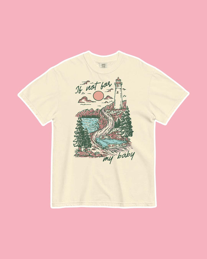 Beige If Not For My Baby shirt for Kate Golden fans featuring an illustrated landscape of a blue, vintage car driving towards a lighthouse with water, pine trees, mountains, and a setting sun around it.