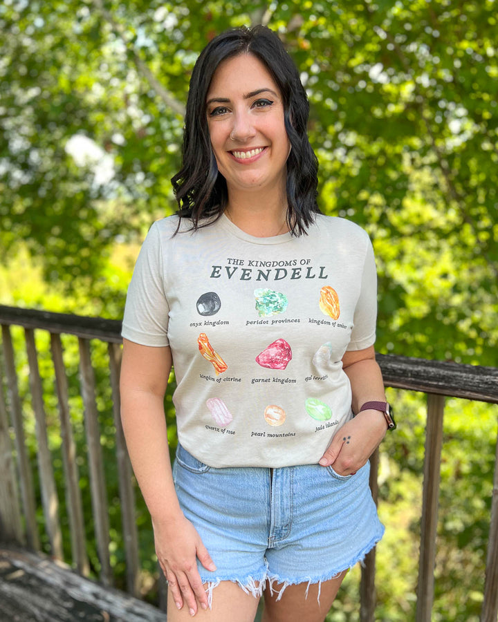 The Sacred Stones shirt featuring the gems of all the Kingdoms of Evendell including onyx, peridot, amber, citrine, garnet, opal, quartz, pearl, and jade.