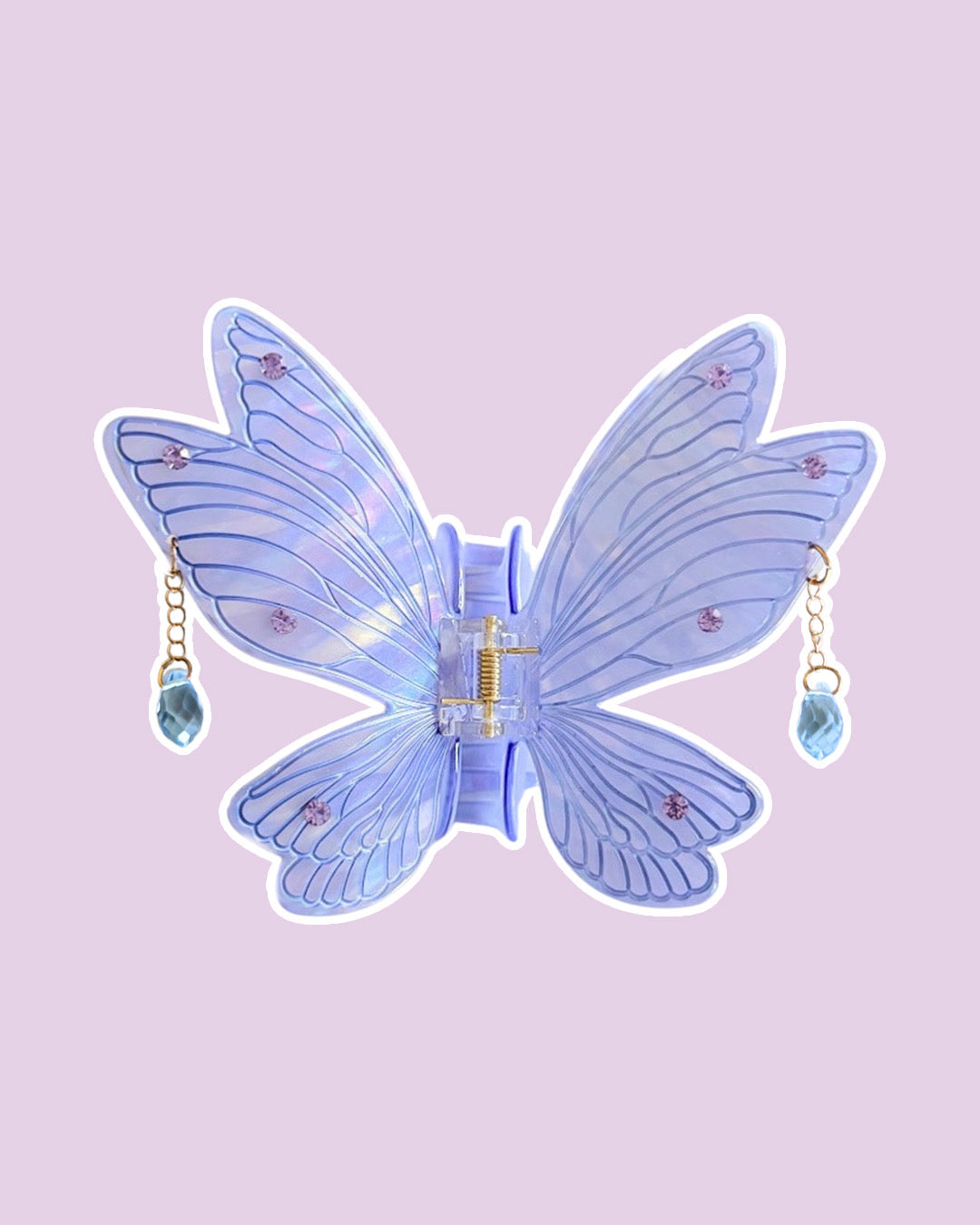 Purple fairy wings with etching details and embedded gems, with dangling gems off the sides on a purple background.