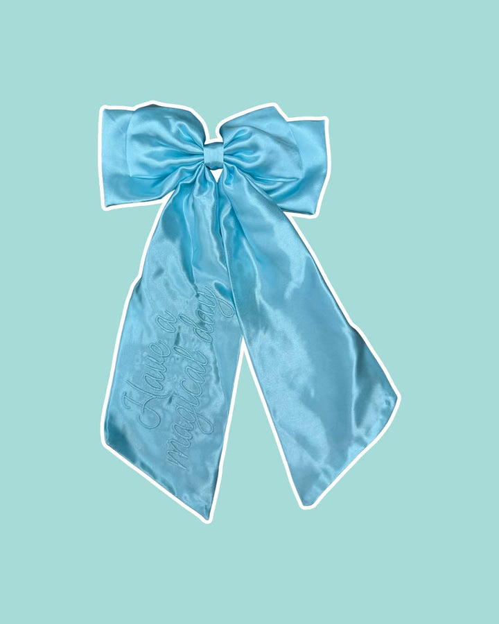 Blue satin hair bow reading &