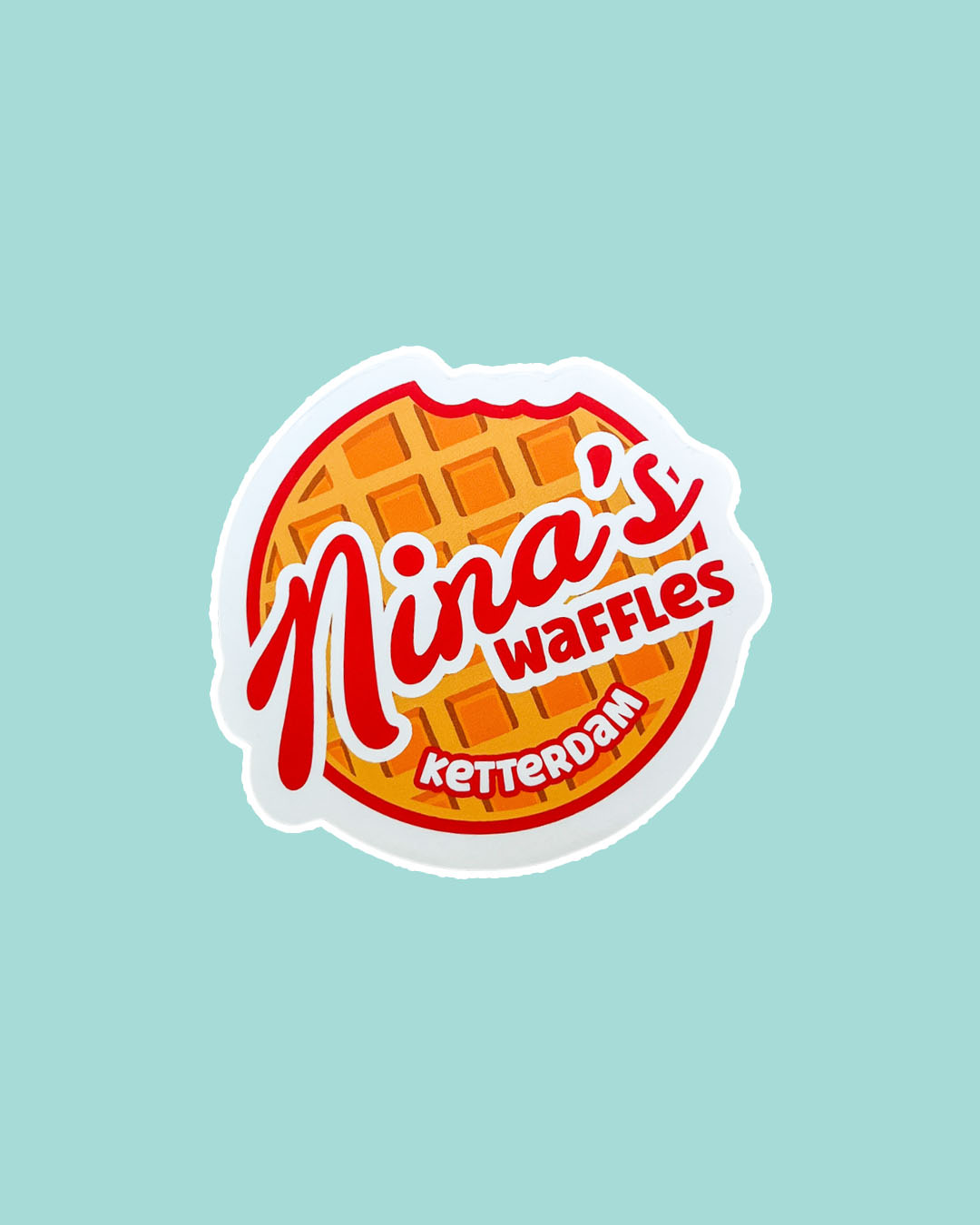 Six of Crows sticker for Leigh Bardugo fans featuring a waffle with a bite taken out of it and 'Nina's Waffles' written over it.