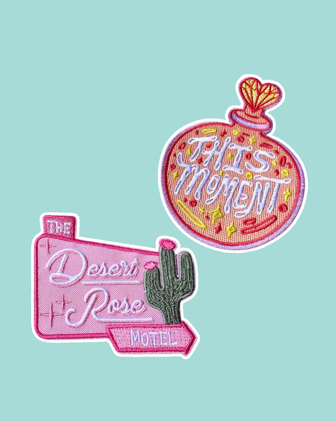 People We Meet on Vacation patch set featuring a perfume bottle with the phrase 'This Moment' written in it and a welcome sign for The Desert Rose Motel in pink with stars and a cactus.