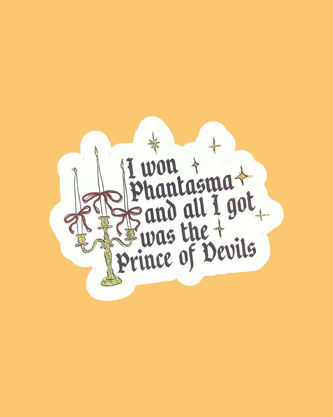 Phantasma sticker featuring the line 'I won Phantasma and all I got was the Prince of Devils' with illustrated elements of a candelabra with bows tied around each candle and stars finished with glitter details.