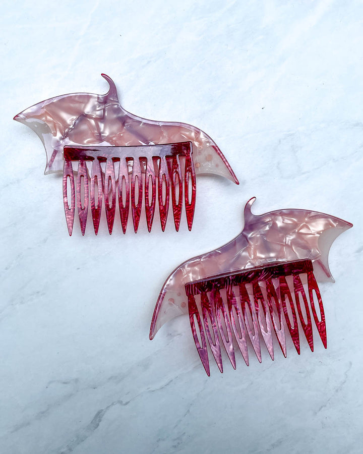 Back of the dragon wing hair accessories featuring a set of pink hair combs and a pearlescent color.