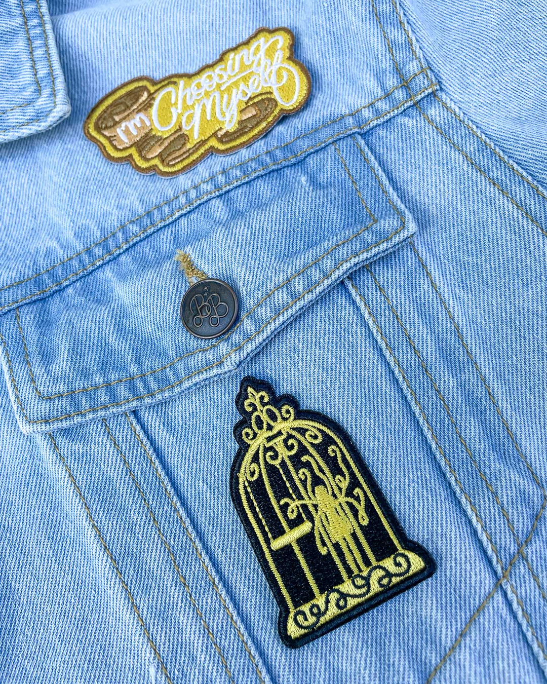 Two patches for Gild fans featuring a gold patch with the quote &