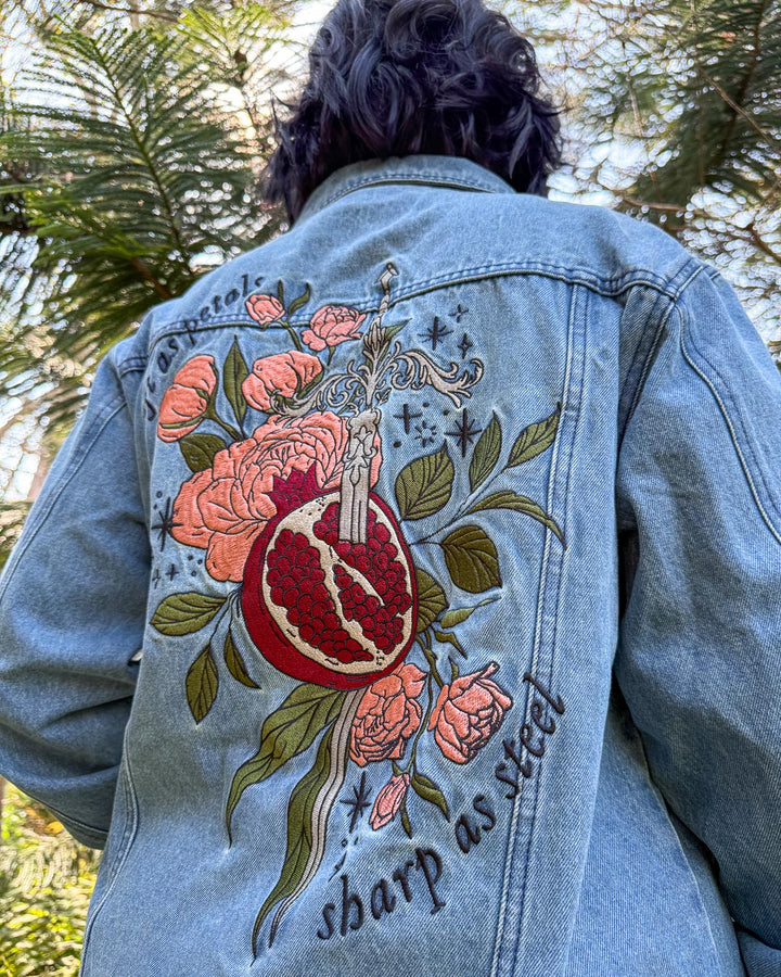Embroidered fantasy jean jacket inspired by Persephone featuring large embroidered design on the back with the quote &